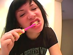Andi brushes her teeth before bed