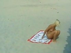 Nude blonde fucked on the beach after peeing