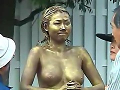 Green Japanese garden statue has tits felt up