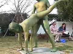 Green Japanese garden statues fuck in public. A Japanese pornstar is..