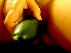 Wife fucks herself with cucumber.