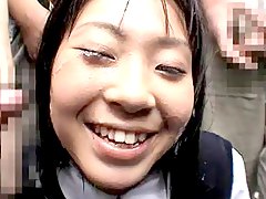 Japanese girl receives a bukkake  in publi
