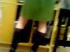 Bookstore worker in green dress 
