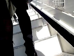 Girl in black stockings on a plane stair 
