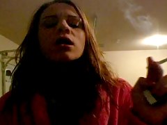Teenager in bathrobe smokes se