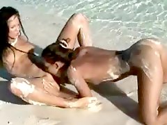 Tight Euro lesbians on the beach get naughty 