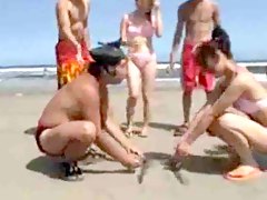 Japanese girls wrestling on the beach