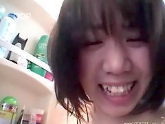 Japanese babe sucking cock in the bathroom