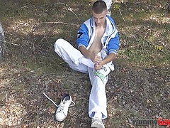 Twink rubs feet in solo and jerks his cock