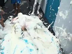 Roommates tag of war soak in whipcream in inflatable pool 