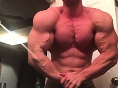 muscle guy showing off his super built 
