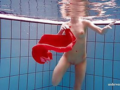 Sexy naked twat Avenna swims nude in the pool