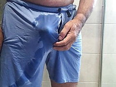 Pissing in blue shorts