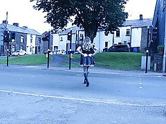 Crossdressed in maid uniform on a street with passing cars