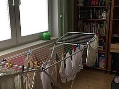 CD Crossdresser Hanging up laundry in DW Lingerie 