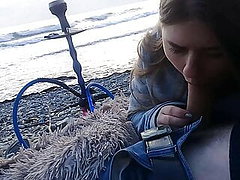 The girl sucked right on the beach near the sea 