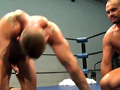 Hunky guy makes his boyfriend do pushups in the ring 