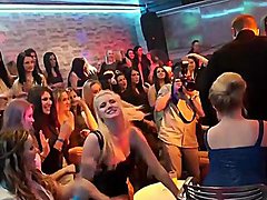 Ladies in naughty club clothes dance with male strippers