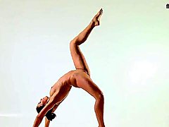 Flexible naked beauty bends her body in beautiful ways