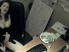 Busty babe fucks a carrot in her office 