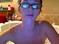 Camgirl hops in the bathtub and washes tits 
