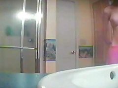 Big tits babe in bathroom voyeur video
