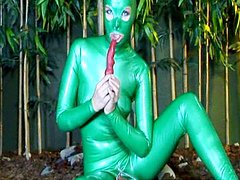 Babe Camila poses in hot green latex 