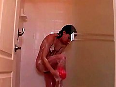 Teen with a nice bush soaps up in the shower 