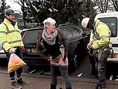 Cheeky girl pees in front of construction workers 