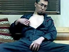 Asian pulls out his dick and cums on his chest 