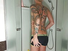 Young guy jerks off in the shower plays with dildo 