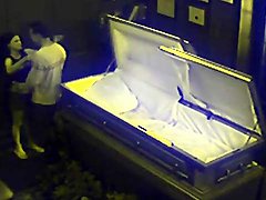 Voyeur sex in a coffin with a kinky couple