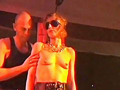 Leather girl bound and flogged in the club 