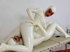 Agate and Tanja are dressed in pretty white latex 