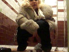 Sexy blonde is pissing sexy in the cold situation 