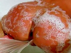 Slender soapy babe Gina Lynn pokes her wet 