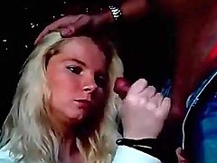 Blonde girl sucks cock on a park bench 