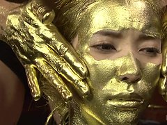 Japanese Submissive In Gold Body Paint Fingers Her 