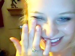 Smiling blonde is sucking a dick on the cam 