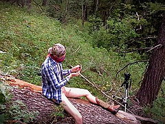 Outdoor twink wanks himself on a log wearing big boy boots 