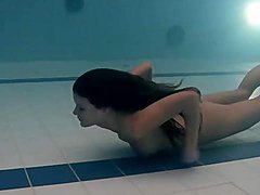 Tight one piece swimsuit on underwater girl 