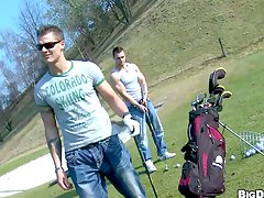 Muscular handsome studs tease each other in the golf course