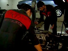 Horny brunette babe fucked by two mechanic guys !