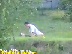 Horny couple having sex on grass caught