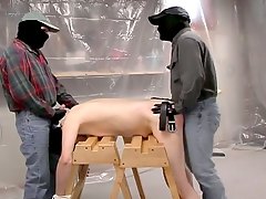 Gay is tied to workhorses and gets spanked and fucked from both ends